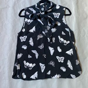 Equipment silk butterfly print, tie neck blouse size small.